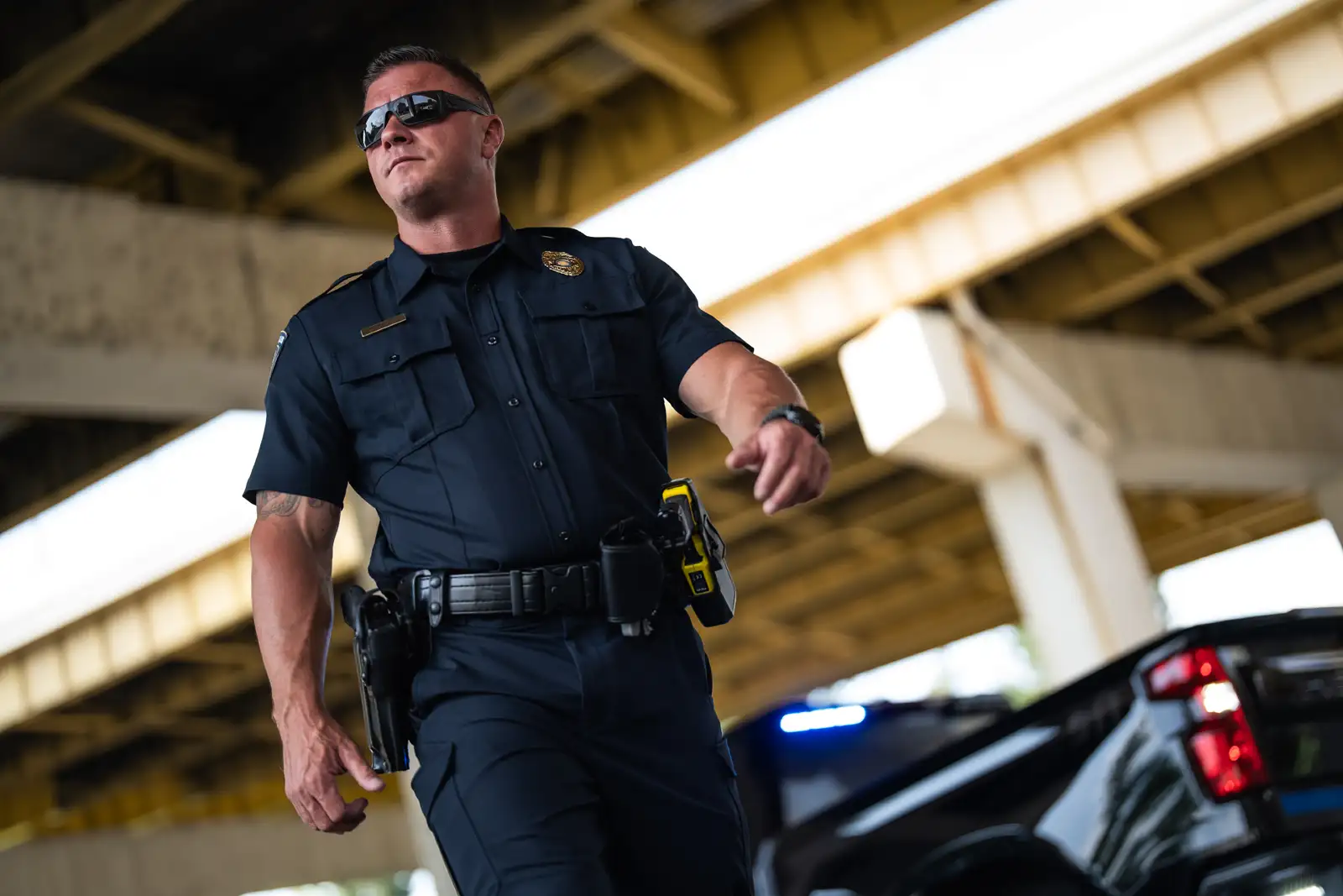 police man wearing titanflex in parking garage