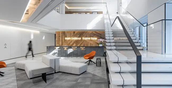modern workplace with white stairs modern seating arae with wood accent wall