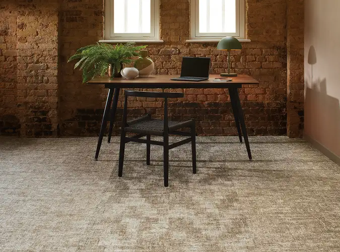 warm space with wood desk and chair on carpet tile from the Quite Statement collection