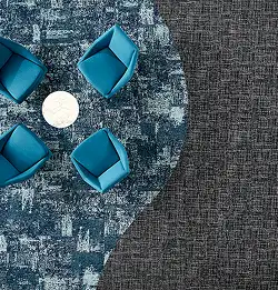 Areal view of a beautiful carpet tile installation with curved cut in with blue and gray products