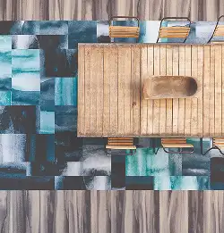aerial view of a large wooden table with colorful Milliken carpet tile flooring