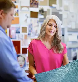 person showing a Milliken carpet tile