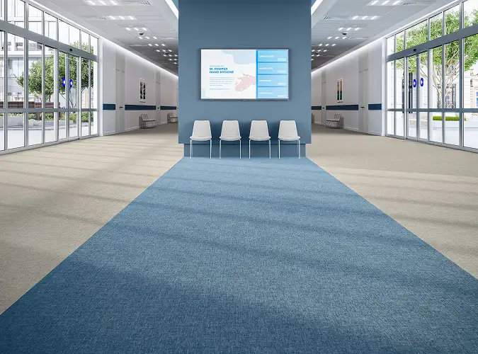 large open public space with blue and gray resilient flooring