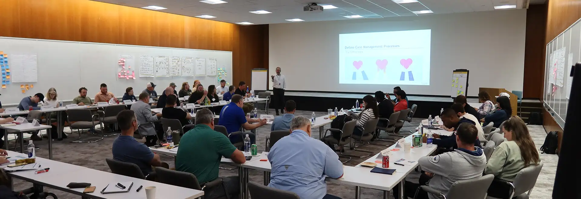 large group of people in calssroom setting