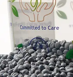 Recycling Additive pellets with cup in background