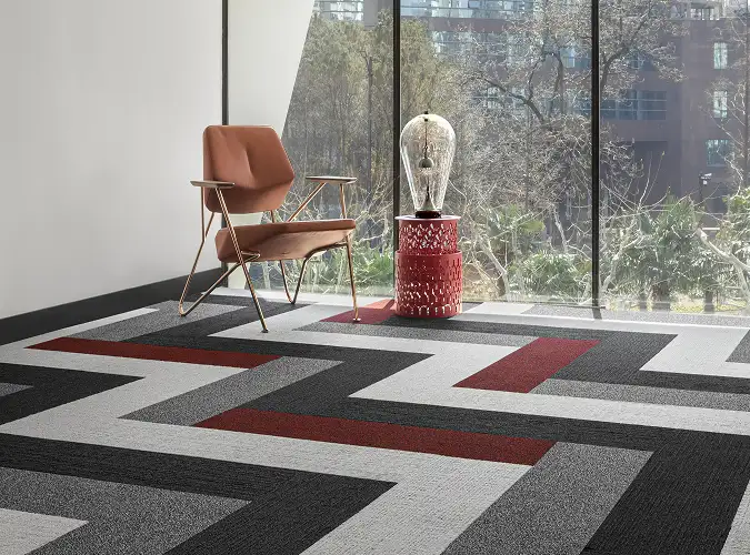 Chair table and glass art on carpet tile from the Design Destinations collection