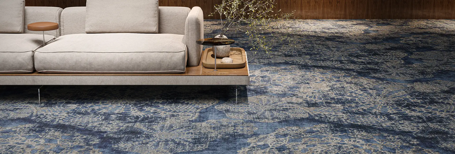 Modern sofa on blue and white patterned carpet tile from the Alt Era collection