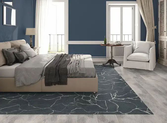 Comfortable home with blue modular carpet surrounded by LVT