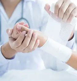 close up of someone treating a wrapped arm