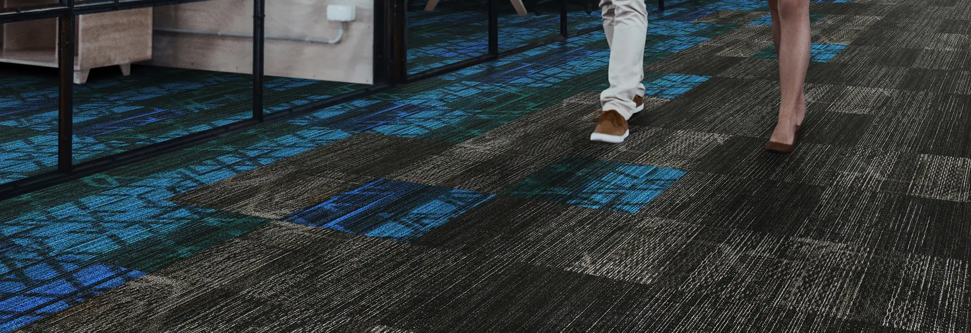 People walking on Milliken WellBac carpet tile