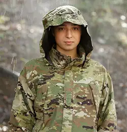 person wearing military rain jacket in the rain