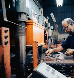 person working at large machinie