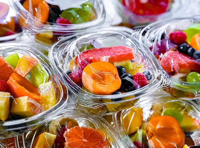 Clear containers with colorful fruits