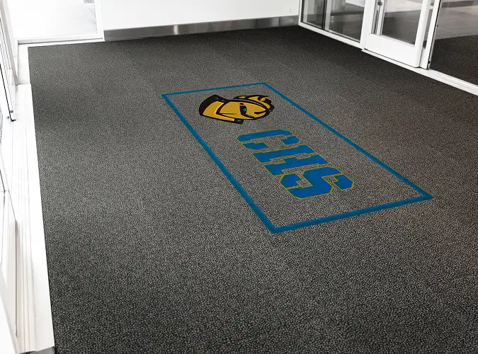 logo in entryway flooring using OBEX Identity Tiles