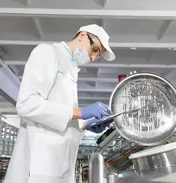 person wearing white with mask and clip board expecting foos