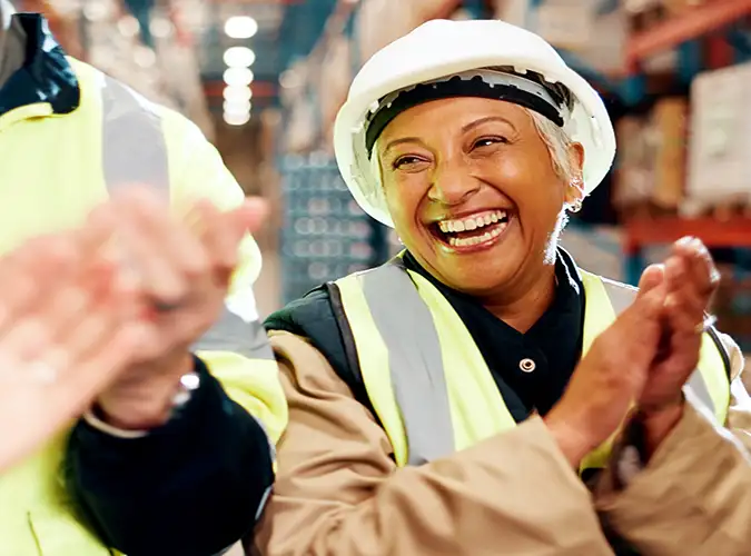 excited person smiling with safety gear 