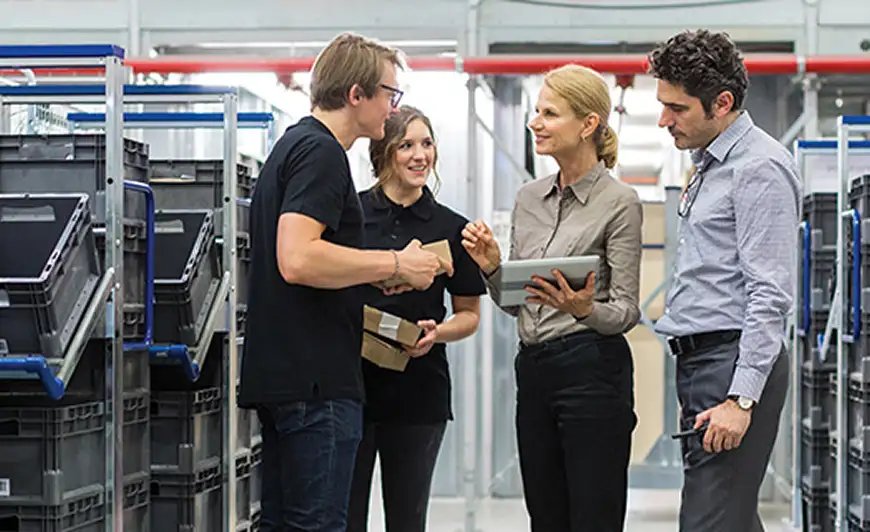 poeple collaborating on a plant floor