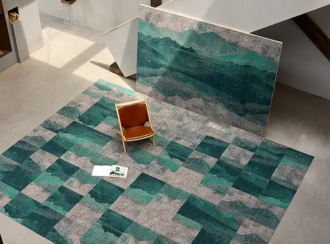 top view of a chair and carpet tiles shown as piece of art and broken apart on the floor under the chair