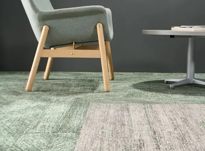 Green chair on New Ground carpet tile