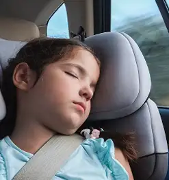 child asleep in car seat