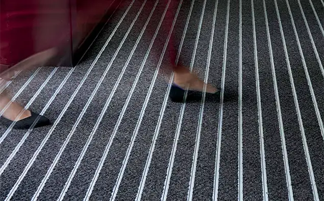 close shot of OBEX Bar with a person walking fast over it