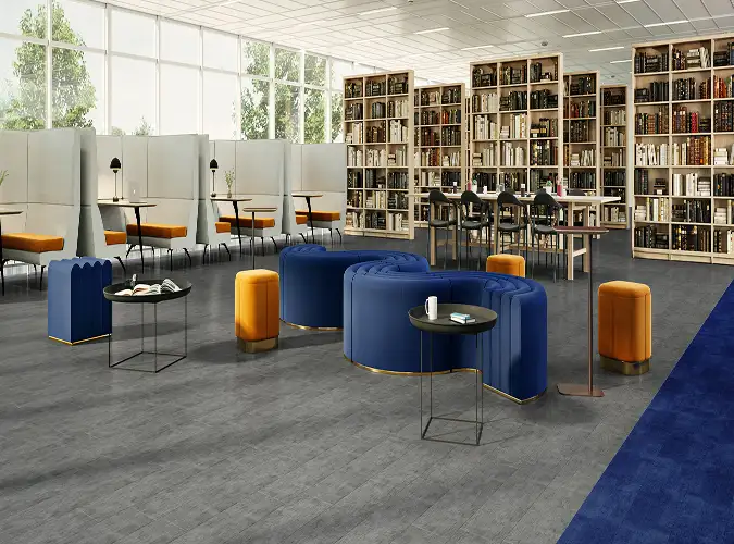 Modern library with curved blue sofas on Lumenology Resilient Flooring