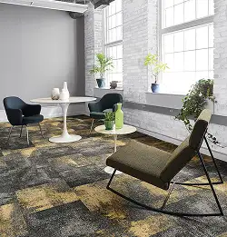 sitting area with painted bricks plants and textured carpet tile flooring