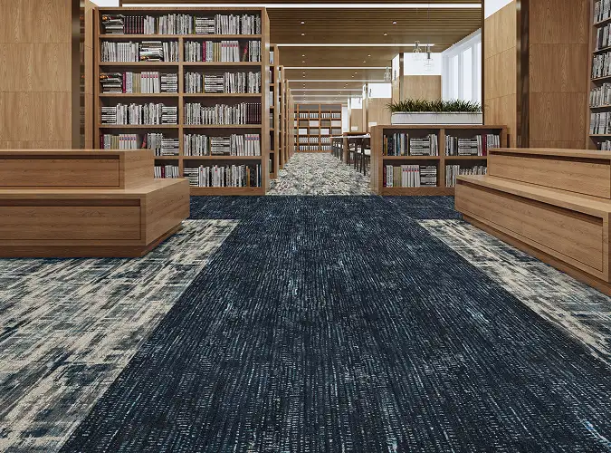 Library with wood shelves and textured carpet tile flooring