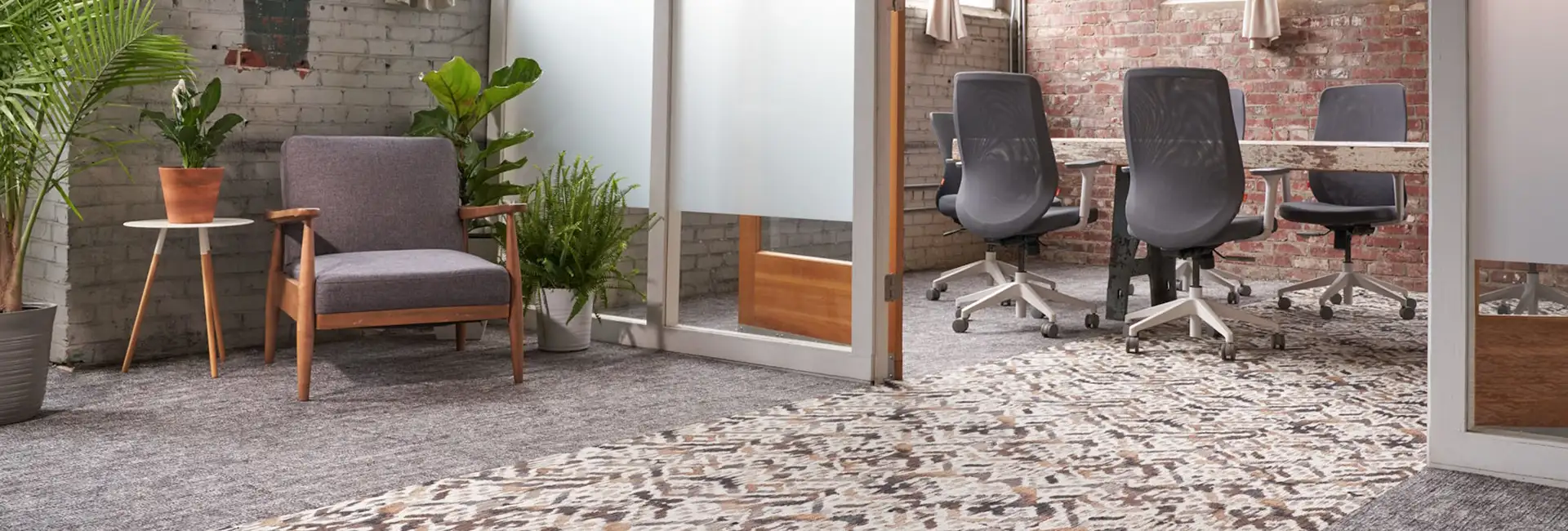 Public space with textural carpet tile with geometic carpet inset