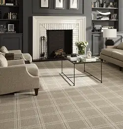 residential interior with gray wall and white fireplace clam carpet installation with beige and white grid design