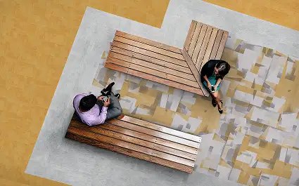 Aerial of people sitting on wooden benches on LVT from Lumenology collection
