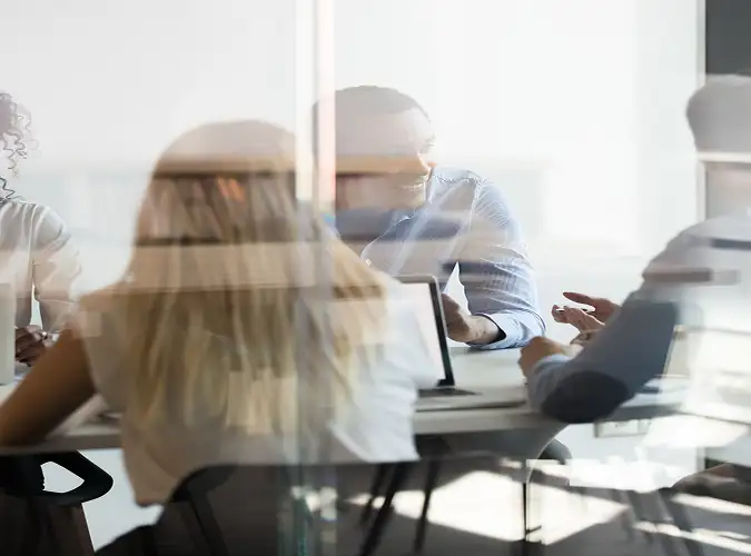 blurred image of people collaborating