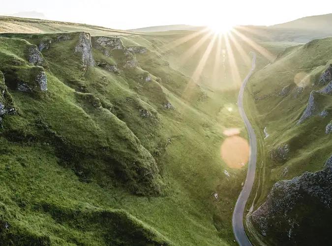 Green mountain valley with sun 