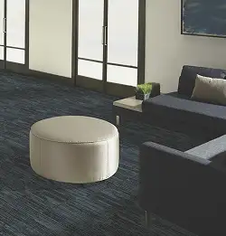 Entry space with white round ottoman