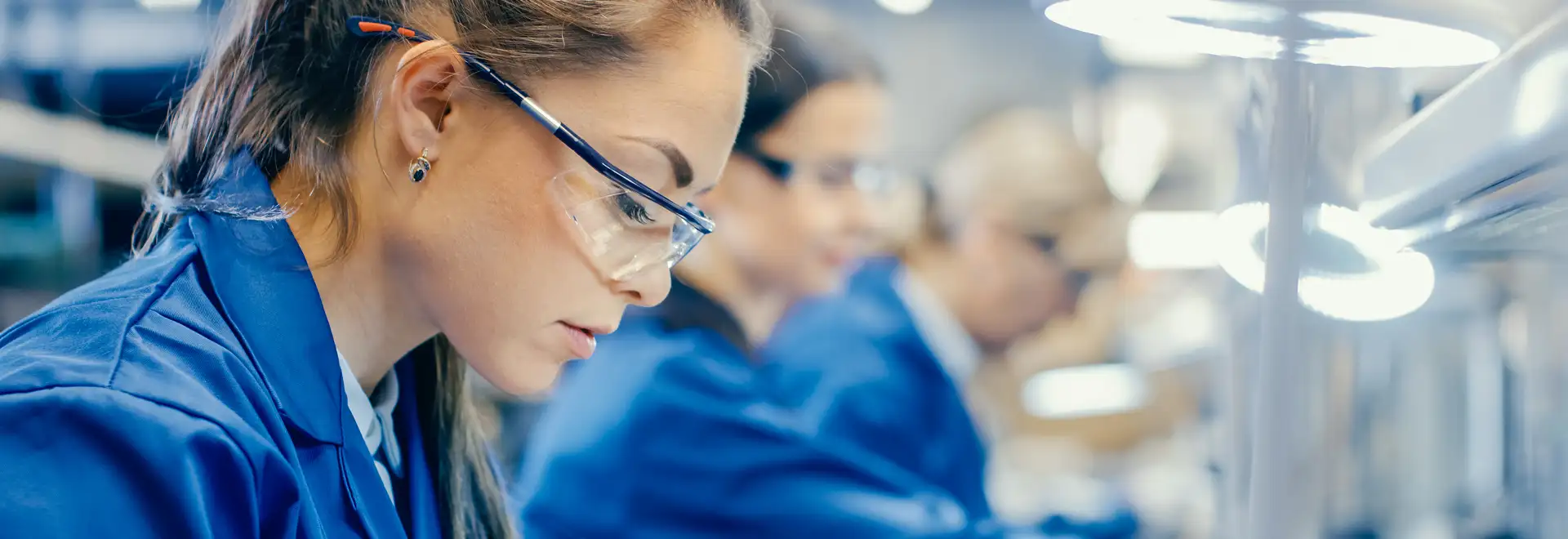 Chemist in lab coat and saftey glasses