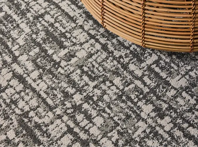 close shot of rattan stool guestroom with Ignited Earth flooring