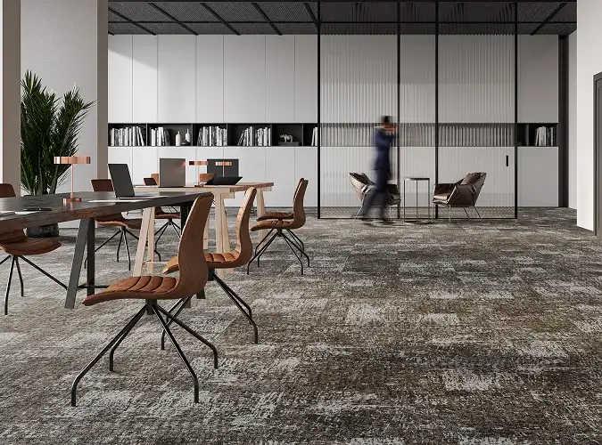 public space in workplace with seating and textural carpet tiles on the floor