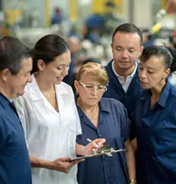 group of associates looking at a clipboard