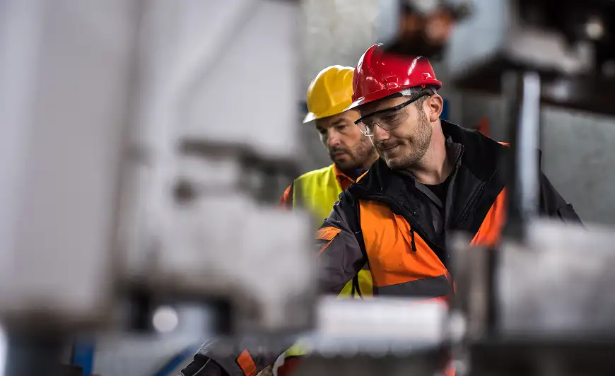 two workers in safety gear