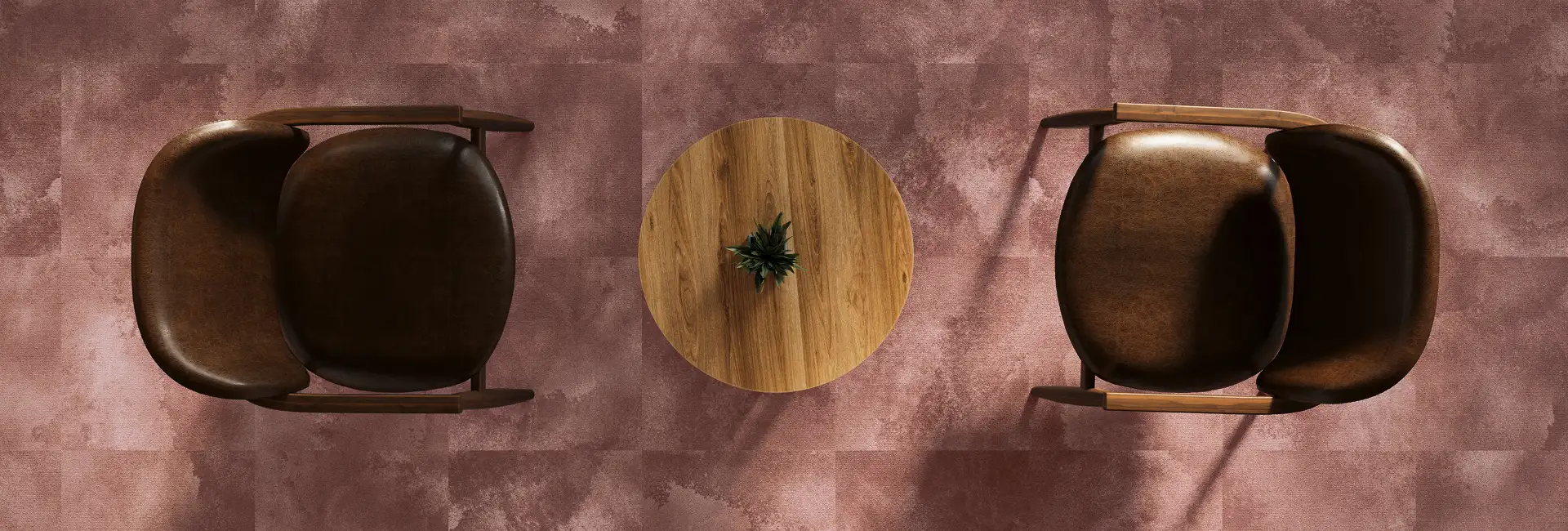 seating arae seen from above with textural red carpet tile flooring