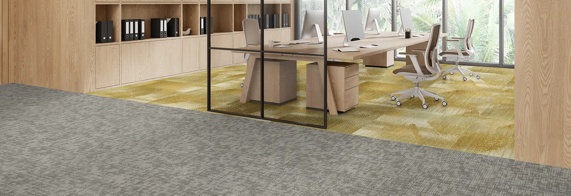 open office workspace with yellow and gray carpet tile flooring