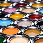 colorful paints in opened cans representing coating additives