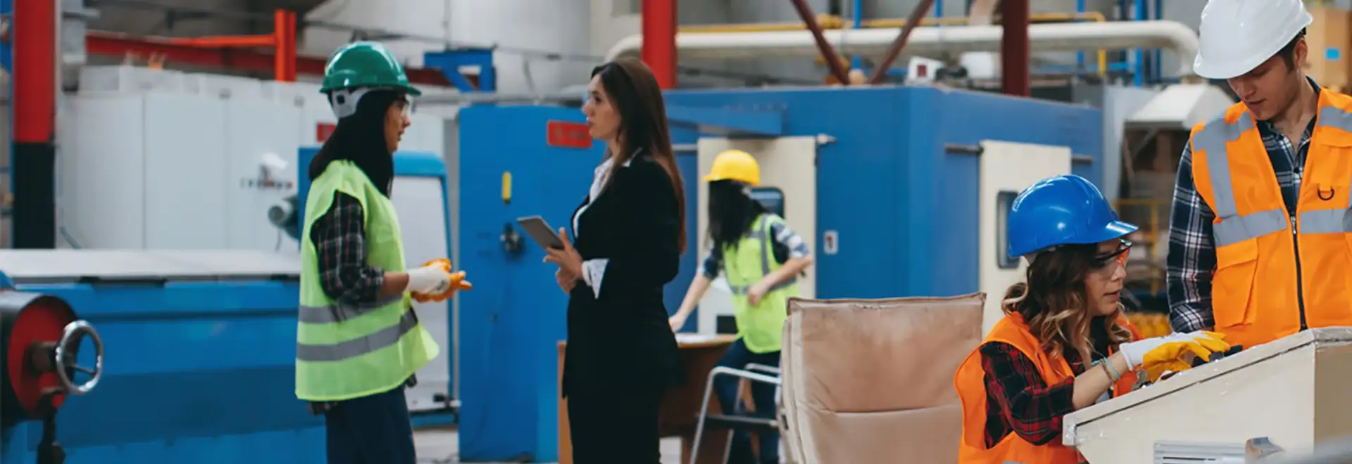 groups of assocaites collaborating on manufacturing plant floor