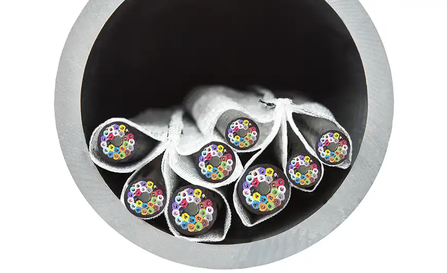 close up of cables in pipe using MIlliken's Opticell™ for ease of pulling