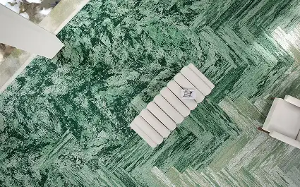 seating area from above with plank carpet installation of an organic design in emerald green