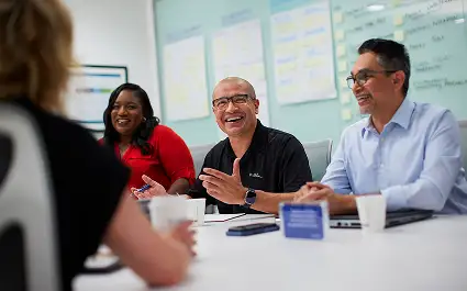 Audience of manufacturing leaders attending a Performance Solutions by Milliken conference presentation