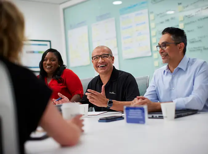 assocaites smiling and collaborating