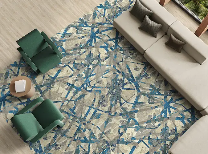 view from above of a seating area with LVT flooring with a carpet tile insert in blue colors