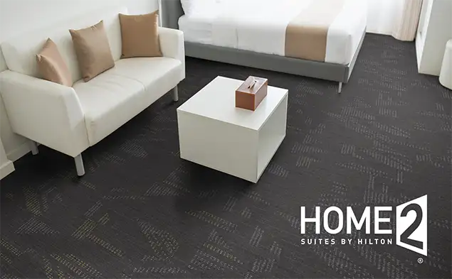 Guestroom with carpet from the Home2 Dynamic scheme