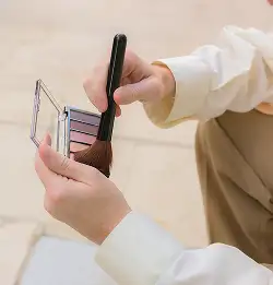 close up of a person with a makeup kit